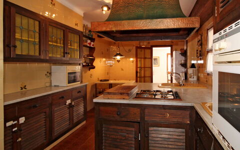Catalonia: Countertop, Cabinetry, Property, Furniture, Drawer, Wood, Kitchen, Interior Design, Architecture, Floor