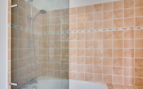 Les Portes Cartier: Bathtub, Plumbing Fixture, Shower Head, Tap, Bathroom, Interior Design, Lighting, Architecture, Wood