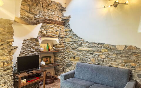 Valloria 602: Interior Design, Flooring, Ceiling, Room, Stone Wall, Living Room, Couch, Chair, Houseplant