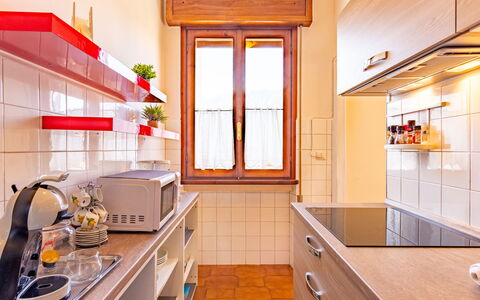 Villa del Sole: Cabinetry, Property, Countertop, Building, Kitchen, Kitchen Appliance, Interior Design, Orange, Lighting