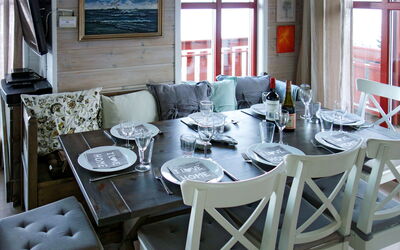 Elistova: Table, Couch, Furniture, Property, Window, Picture Frame, Chair, Tableware, Plant, Building