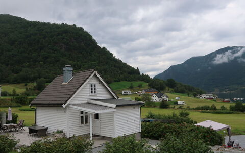 Ikjefjord: Cloud, Sky, Plant, Mountain, Property, Building, Window, Tree, Highland, House
