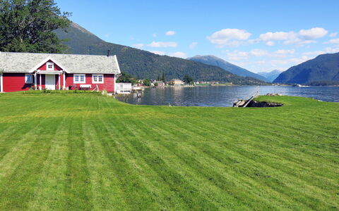 Naustet: Sky, Water, Cloud, Plant, Property, Green, Building, Mountain, Nature, Natural Landscape
