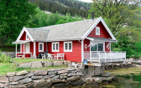 Naustet: Plant, Building, Window, Property, Sky, Tree, House, Water, Natural Landscape, Cottage