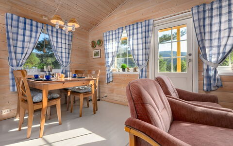 Synnøve: Table, Furniture, Couch, Window, Plant, Building, Wood, Living Room, Shade, Tree