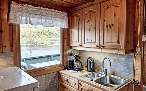 Spangereid 651: Wood, Kitchen, Sink, Tap, Countertop, Plumbing Fixture, Furniture, Cabinetry, Wood Stain, Room