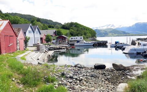 Rorbu: Cloud, Water, Sky, Plant, Boat, Watercraft, Building, Mountain, Highland, Vehicle