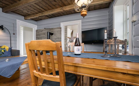 Johans Maria Stova: Furniture, Property, Table, Picture Frame, Wood, Lighting, Building, Interior Design, Bottle, Floor