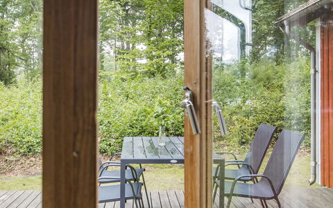 Ängsjömåla: Plant, Furniture, Chair, Wood, Porch, Shade, Tree, Hardwood, Grass, Cottage