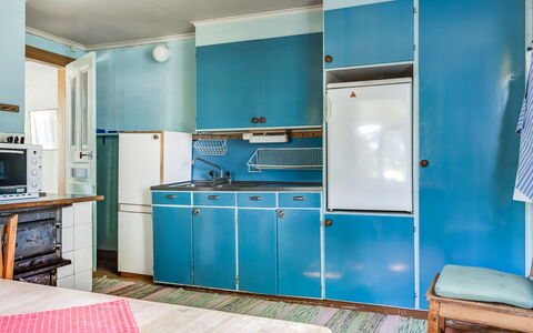 Ebbabolet: Cabinetry, Countertop, Furniture, Blue, Building, Interior Design, Wood, Lighting, Home Appliance, Kitchen