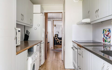 Löaborn: Cabinetry, Property, Countertop, Kitchen, Building, Kitchen Stove, Interior Design, Kitchen Appliance, Lighting, Flooring