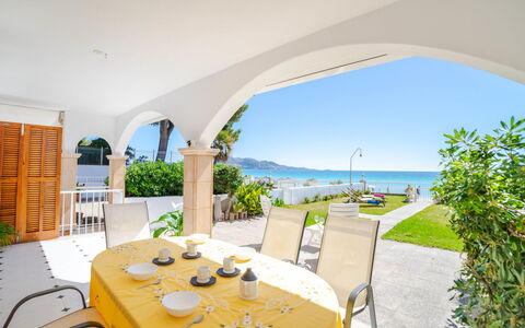 Sa Mirada: Table, Plant, Building, Furniture, Sky, Chair, Water, Shade, Houseplant, Tree