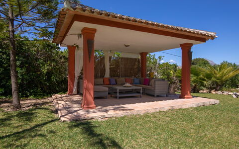 Villa Adelfa: Sky, Plant, Plant Community, Table, Tree, Shade, Land Lot, Outdoor Furniture, Wood, Grass