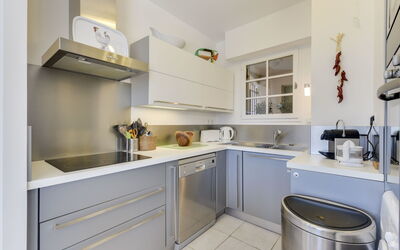 Les Terrasses de Grimaud 202.1: Property, Room, Furniture, Countertop, Kitchen, Cabinetry, Yellow, Interior Design, Building, Floor