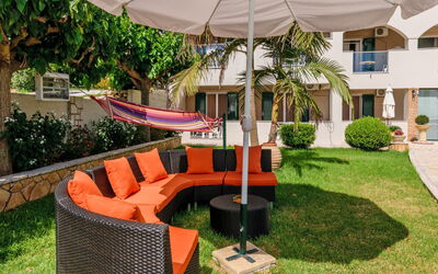 Ammoudi 1: Property, Furniture, Real Estate, Backyard, Resort, House, Wicker, Patio, Grass, Leisure
