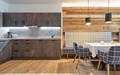 Appartement Mont Blanc 751.9: Countertop, Room, Furniture, Kitchen, Cabinetry, Property, Interior Design, Floor, Tile, Hardwood