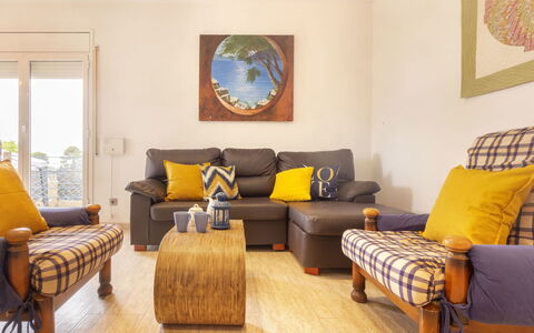 Cap Roig: Living Room, Room, Furniture, Yellow, Interior Design, Property, Floor, Couch, Table, Wood Flooring
