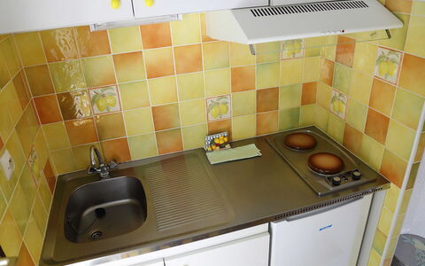 Les Marmottes: Tile, Room, Property, Kitchen, Countertop, Sink, Yellow, Floor, Furniture, Kitchen Stove