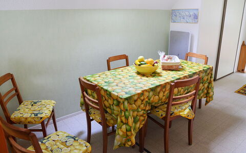Les Marmottes: Tablecloth, Yellow, Room, Furniture, Table, Property, Chair, Dining Room, Interior Design, Textile