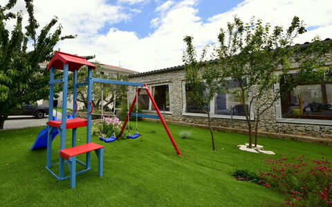 East: Playground, Grass, Public Space, Property, Outdoor Play Equipment, Backyard, Leisure, Lawn, House, Yard