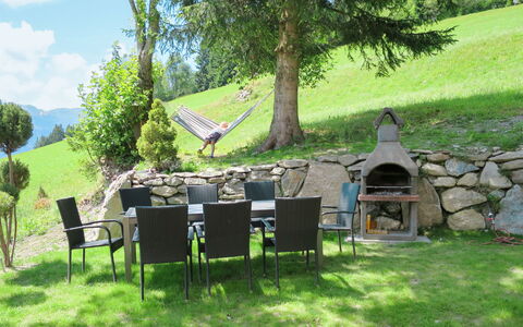 Alm Chalet: Plant, Property, Tree, Shade, Land Lot, Cloud, Outdoor Furniture, Table, Sky, Leisure