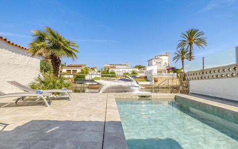 Sunset: Sky, Water, Plant, Building, Tree, Swimming Pool, Arecales, Leisure, Outdoor Furniture, Resort Town