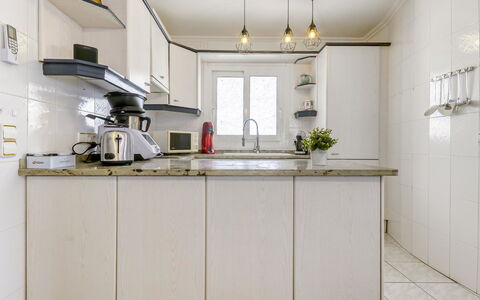 Sunset: Cabinetry, Countertop, Kitchen, Window, Tap, Wood, Lighting, Kitchen Sink, Interior Design, Building