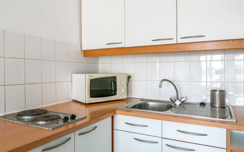 Casa Itzuli: Countertop, Cabinetry, Kitchen Sink, Property, Sink, Kitchen Appliance, White, Kitchen, Kitchen Stove, Building