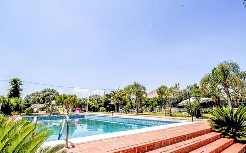 White Pool: Water, Plant, Sky, Swimming Pool, Tree, Leisure, Landscape, Grass, Recreation, Resort Town