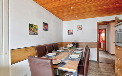 Born 1 110.1: Table, Property, Furniture, Cabinetry, Wood, Interior Design, Chair, Floor, Flooring, Living Room