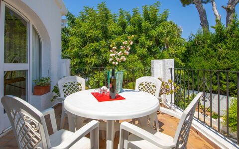 Florencia: Table, Plant, Furniture, Property, Flower, Chair, Flowerpot, Sky, Azure, Outdoor Table