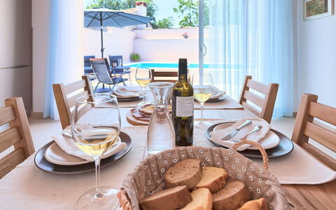 Mala Mare: Table, Tableware, Furniture, Food, Chair, Dishware, Plant, Bottle, Wood, Window