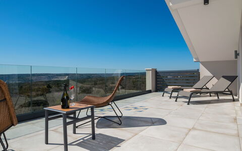 A.r.t.: Sky, Furniture, Building, Table, Wood, Chair, Shade, Outdoor Furniture, Floor, Urban Design