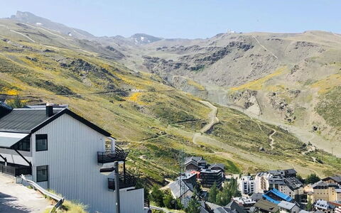 Bellevue: Sky, Mountain, Ecoregion, Building, Slope, Highland, House, Grass, Terrain