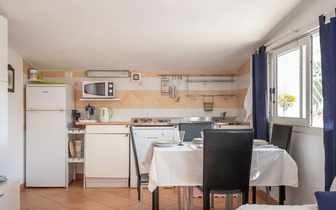 Villetta Laura: Property, Room, Furniture, Building, Kitchen, House, Interior Design, Floor, Yellow, Real Estate