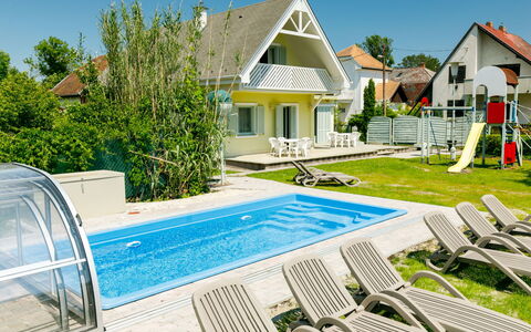 Sapphire: Sky, Plant, Building, Azure, Window, House, Swimming Pool, Outdoor Furniture, Land Lot, Tree