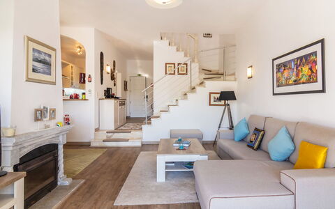 Roberts: Room, Property, Furniture, Interior Design, Living Room, Floor, Building, House, Wall, Yellow