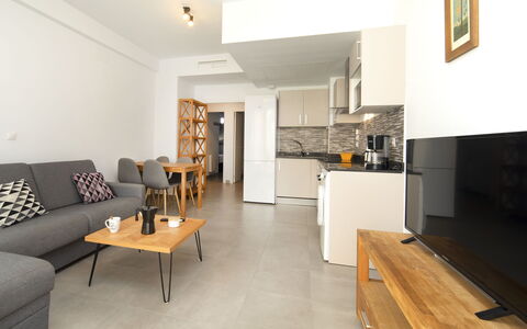 Calpe Beach i: Furniture, Table, Cabinetry, Couch, Countertop, Interior Design, Wood, Building, Floor, Flooring