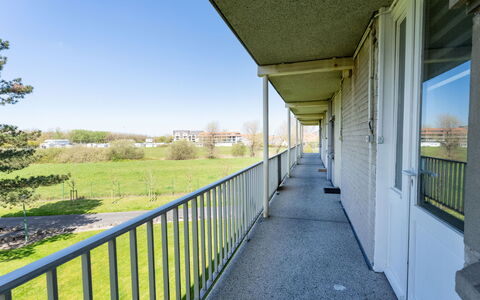 De Haan 311: Apartment, Lawn, Shade, Estate, Balcony, Landscaping, Yard, Walkway, Fence, Porch