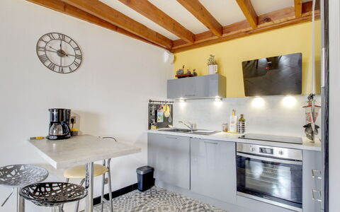 Emeuraude: Property, Cabinetry, Countertop, Interior Design, Lighting, Table, Flooring, Architecture, Wood, Floor