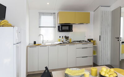 Camping la Plage 649.2: Room, Yellow, Property, Furniture, Kitchen, Countertop, Cabinetry, Interior Design, Floor, Building