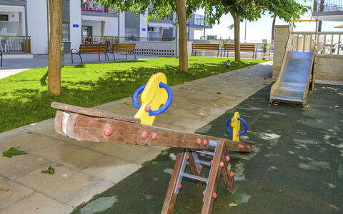 Costa Playa: Public Space, Playground, Human Settlement, Table, Furniture, City, Tree, Outdoor Play Equipment, Recreation, Outdoor Furniture