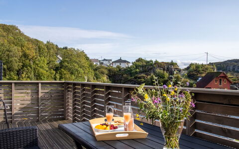 Langevåg 604: Cloud, Flower, Sky, Plant, Property, Flowerpot, Furniture, Table, Building, Outdoor Furniture
