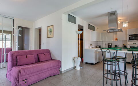 Les Baïnes: Furniture, Table, Comfort, Wood, Couch, Lighting, Picture Frame, Flooring, Floor, Living Room