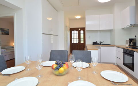 Mihotić: Table, Furniture, Property, Cabinetry, Tableware, Building, Chair, Dishware, Wood, Lighting