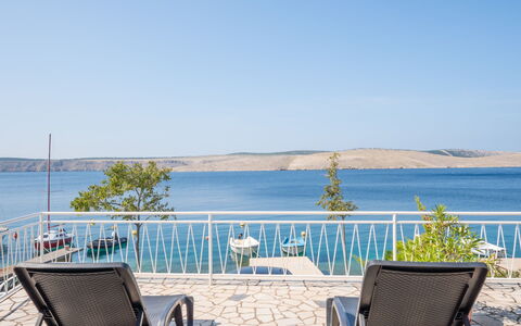 Iris: Water, Sky, Furniture, Building, Blue, Chair, Azure, Outdoor Furniture, Lake, Plant