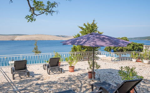 Iris: Water, Sky, Plant, Property, Furniture, Nature, Shade, Azure, Beach, Chair