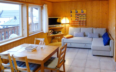 Sur Baselgia: Table, Furniture, Property, Picture Frame, Couch, Wood, Lamp, Lighting, Interior Design, Living Room