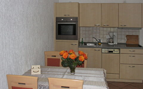 Gollwitz (Insel Poel) 110: Room, Property, Furniture, Kitchen, Cabinetry, Orange, Major Appliance, Countertop, Interior Design, Building