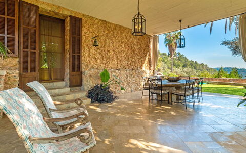 Santa Llucia: Furniture, Plant, Property, Window, Shade, Table, Interior Design, Outdoor Furniture, Chair, Building